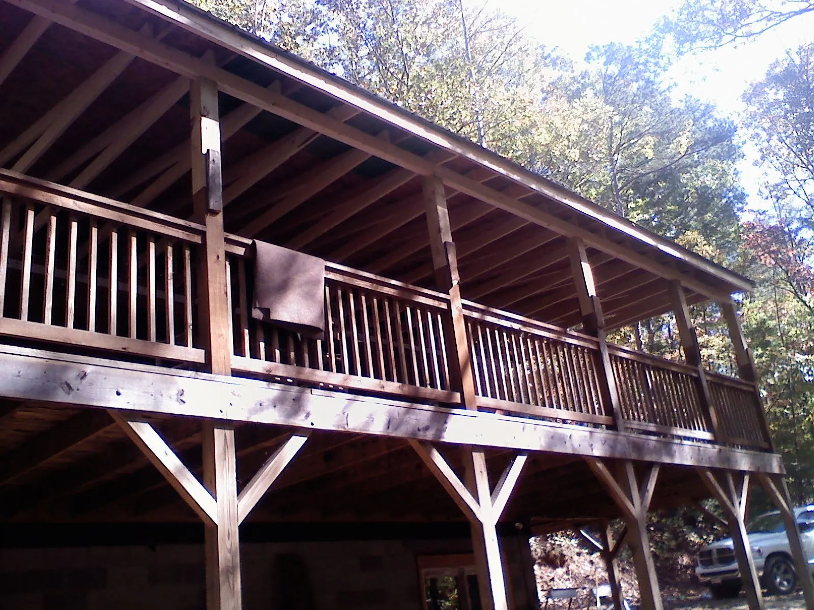 Timber framing under a new elevated porch and deck — Roof Leak Repair in Red Oak by Roofing Brothers